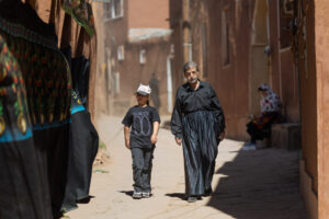 The beginning of the procession in Abyaneh village. Locals who relocated return to participate in the ritual ceremony of Ashura & Tasua.